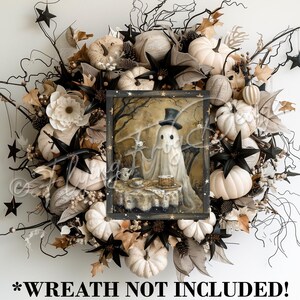 May include: A white ghost with a top hat sits at a table with a teacup and saucer, a teapot, and a plate of cookies. The ghost is surrounded by a dark forest with stars in the background. The image is framed in a black frame with gold stars.