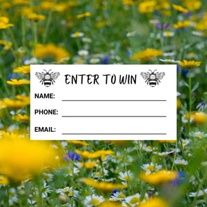 May include: White card with black text and bee illustrations. The text reads "Enter to Win". There are lines for name, phone, and email.