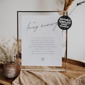 Puede incluir: Un cartel imprimible con el texto "In loving memory" y un mensaje para recordar a un ser querido en una boda. El cartel está enmarcado en un marco plateado y tiene un corazón en la parte inferior.