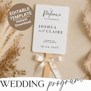 May include: A white wedding program fan with the text "Welcome" and the names "Joshua and Claire." The program includes the wedding date and location. A cream-colored ribbon is tied at the base of the fan.