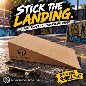 May include: A tan, wedge-shaped fingerboard ramp with a textured surface and the Precision Resins logo embossed on the side. A small black fingerboard with white wheels sits in front of the ramp. Text reads STICK THE LANDING and BUILD BIG, SPEND LITTLE!