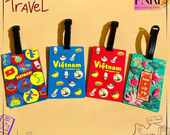 May include: Four colorful luggage tags with black straps. The tags feature designs related to Vietnam, including the text "Vietnam" and various illustrations. One tag says "have a safe trip". The tags are in blue, red, green, and yellow.