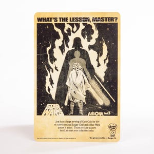 Puede incluir: P&oacute;ster promocional vintage de Star Wars con Darth Vader y Ahsoka Tano. El p&oacute;ster tiene un aspecto envejecido con el texto "WHAT'S THE LESSON, MASTER?" y "AHSOKA Part 5". El logotipo de Burger Chef es visible.