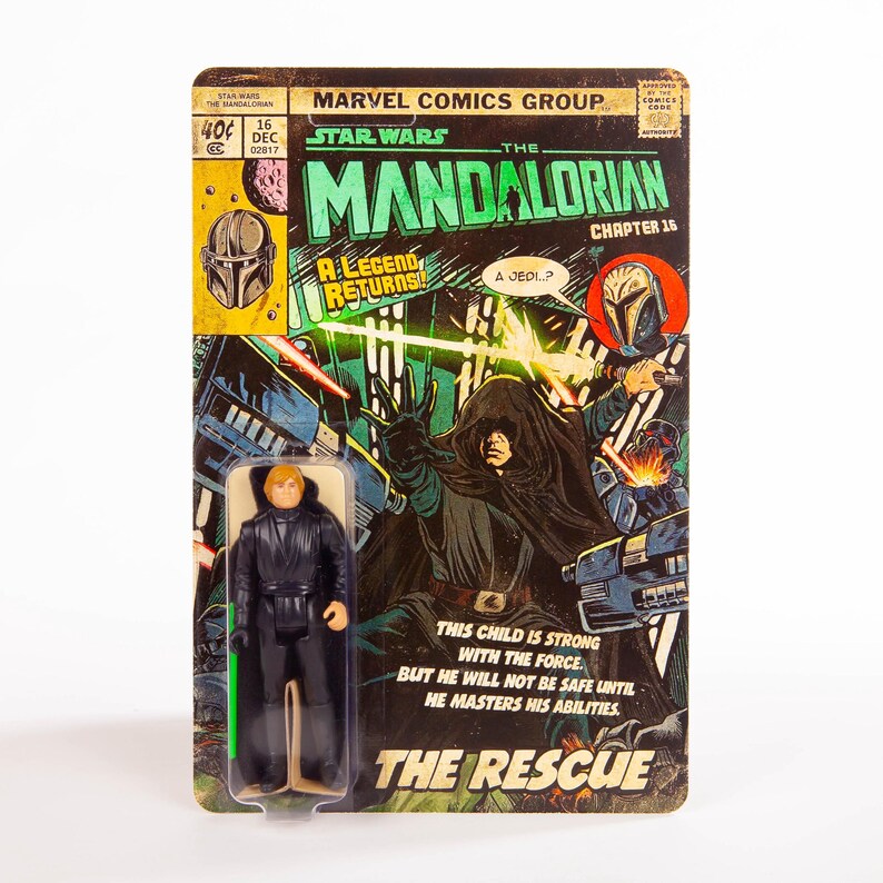 May include: A Star Wars Mandalorian action figure on a vintage-style comic book card. The card features comic book art with the text "The Mandalorian Chapter 16" and "The Rescue". The figure is of a character in a black outfit with a green lightsaber.