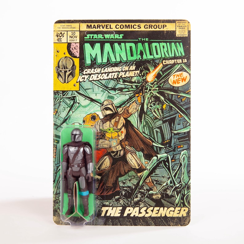 May include: A vintage Star Wars Mandalorian action figure on a comic book-style card. The card features comic book art with the text "The Mandalorian" and "The Passenger." The figure is in a clear plastic blister pack.