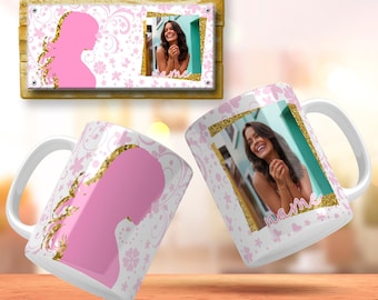 May include: Two white ceramic mugs with a pink and gold design. One mug features a pink silhouette of a woman with gold glitter accents. The other mug features a photo of a woman smiling with the word "name" written in gold glitter. Both mugs have a white background with pink flowers and butterflies.