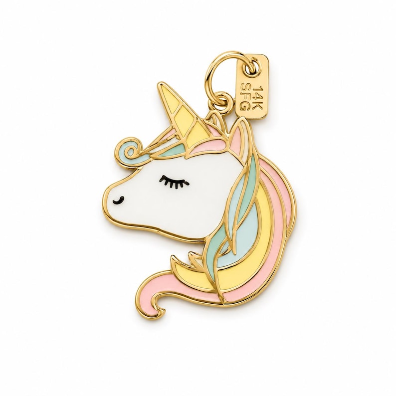 May include: A gold-colored unicorn charm with a white face, closed black eyelashes, and a yellow horn. The unicorn's mane is a mix of pink, yellow, and blue. A small tag with "14K SFG" is attached to the charm.