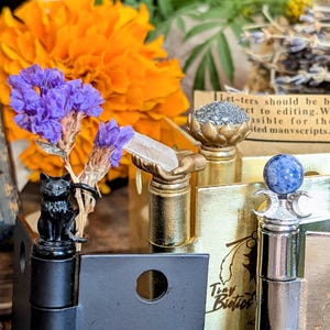 Whimsical witch altar decor on door hinges, each piece cradling a sacred botanical or crystal with a soft magical background