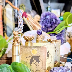 CottageCoreHolly Witch Divination Hinge Head Bundle displayed with natural elements: cat with lavender, lotus bowl with rose, salt bowl, and crescent moon crystal stand