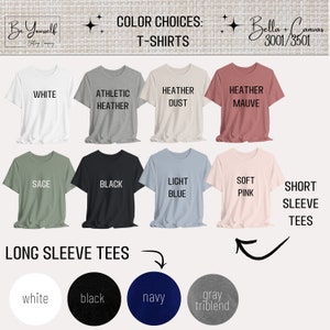 K&ouml;nnte beinhalten: Eine Auswahl an T-Shirts mit kurzen und langen &Auml;rmeln in verschiedenen Farben, darunter Wei&szlig;, Schwarz und Heather Mauve. Das Bild zeigt Farbauswahlen f&uuml;r T-Shirts mit Textbeschriftungen f&uuml;r jede Farbauswahl. Der Markenname "Be Yourself" ist sichtbar.
