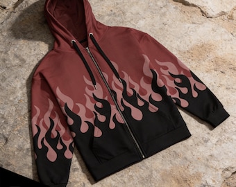 May include: A maroon zip-up hoodie featuring a black flame pattern along the bottom hem and sleeves. The garment includes a hood with black drawstrings, a full-length front zipper, and two front pockets. The text 7 COLOR OPTIONS is visible.