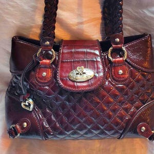 Brighton Stockage Patented Quilted Leather Alligator Skin Print On Flap Weaved Shoulder Straps Heart Bag Charm Deep Burgundy Color image 1