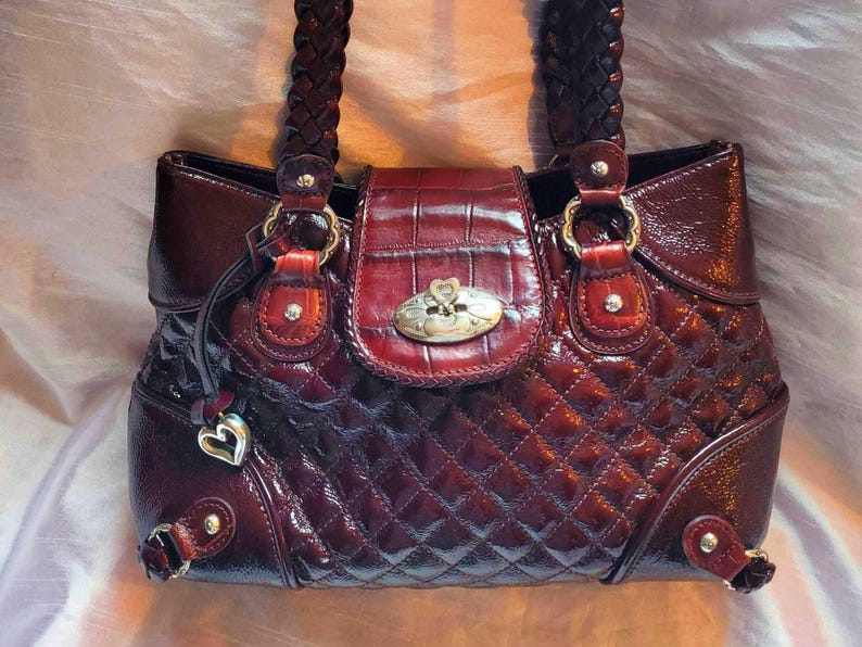 Brighton Stockage Patented Quilted Leather Alligator Skin Print On Flap Weaved Shoulder Straps Heart Bag Charm Deep Burgundy Color image 1