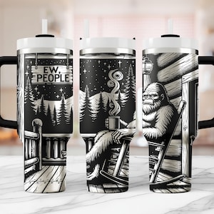 May include: A black and white stainless steel tumbler with a handle. The tumbler features a graphic of a Bigfoot sitting on a porch swing with the text "Ew, People".