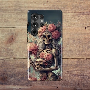 May include: A phone case featuring a detailed illustration of a skeleton adorned with a floral crown and roses. The design includes a skull and intricate tattoos, set against a dark background.