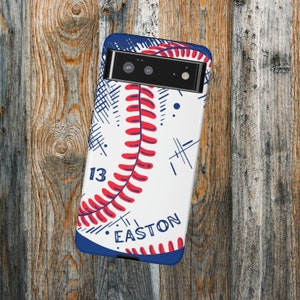 May include: A white and blue phone case with a baseball design. The baseball has red stitching and the number 13 on it. The text "EASTON" is printed on the case.