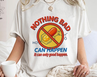 May include: Cream-colored t-shirt with the words "NOTHING BAD CAN HAPPEN" in red and blue, with a graphic of a pill crossed out. The phrase "it can only good happen" is below the main text.