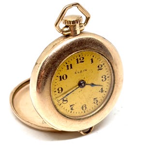 Reparación de reloj de bolsillo antiguo Elgin de cuerda mecánica con baño de oro rosa