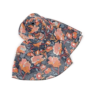 May include: A floral patterned scarf in shades of blue, orange, and pink. The scarf is made of a sheer fabric and has a fringed edge.