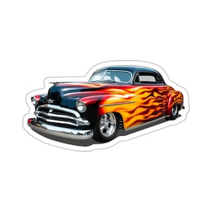 May include: A sticker featuring a classic car with a black roof and a body painted with flames in shades of red, orange, and yellow. The car has chrome bumpers and wheels, and a white outline.