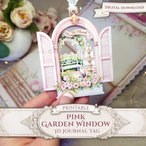 May include: A pink 3D journal tag featuring a garden scene with a fountain, bench, and flowers. The tag has an arched window design with open shutters. Text on the tag reads "Pink Garden Window 3D Journal Tag" and "Bloom & Flourish".