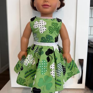 18 inch doll dress, adorable St Patrick’s patchwork shamrock pattern, white ribbon accent.  Hook and loop enclosure for easy on and off.