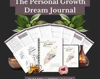 May include: A collection of journals and accessories, including a spiral-bound notebook, a tablet, and loose pages, all with the title "The Personal Growth Dream Journal." The journal features a watercolor feather design. The image also includes a cup of tea, a wooden bowl, and a diffuser.