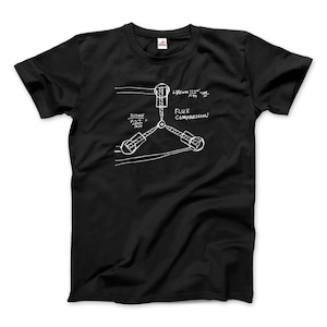 May include: Black t-shirt with a white graphic of a flux capacitor from the movie Back to the Future. The graphic includes the text "Flux Compression" and a diagram with equations.
