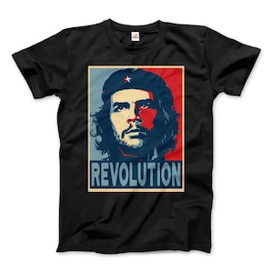 May include: Black t-shirt with a red, white, and blue image of a man with a beard and a star on his hat. The image is in a poster style with the word "REVOLUTION" printed below the image.