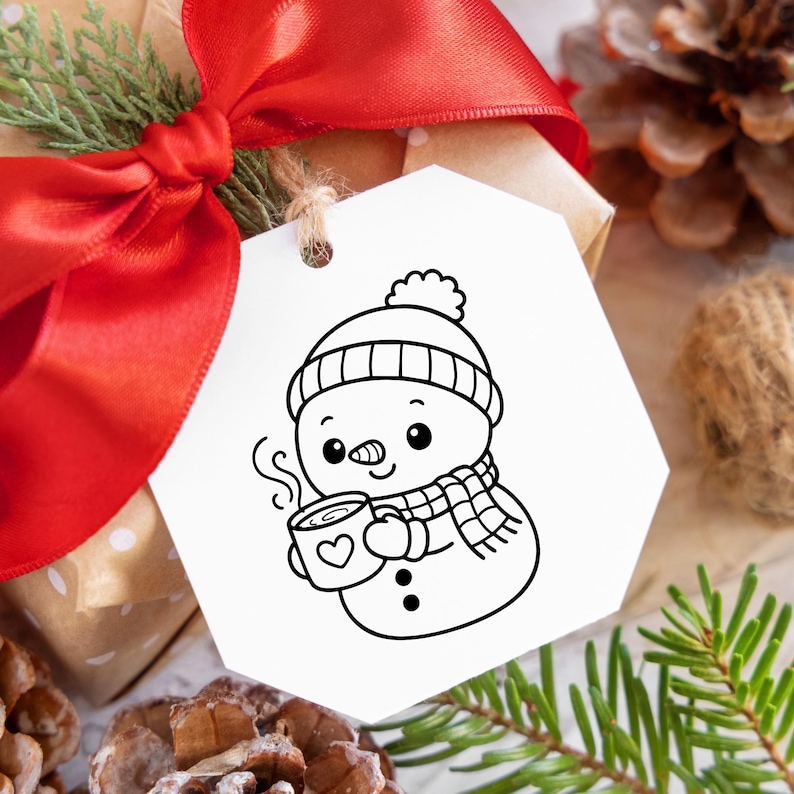 May include: A white gift tag with a cartoon snowman illustration. The snowman wears a hat, scarf, and holds a mug with a heart. A red ribbon and pine needles are in the background.