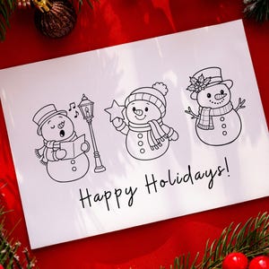 May include: A white card with three cartoon snowmen, a street lamp, and the text "Happy Holidays!" The snowmen are wearing hats and scarves. One is singing, another holding a star, and the third has a flower on its hat.