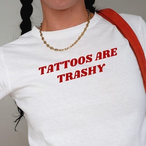Tattoos Are Trashy Baby Tee, funny y2k shirt, bold graphic tee, attitude baby tee, trendy y2k shirt, funny baby tee, y2k graphic shirt