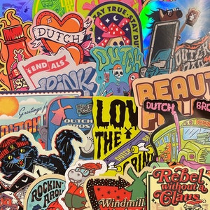 May include: A collection of colorful stickers with various designs, including a heart with the word "DUTCH" inside, a mushroom with a crescent moon, a skeleton holding a drink, and a bus with the words "DUTCH BROS" on the side. The stickers are arranged in a random pattern on a white background.