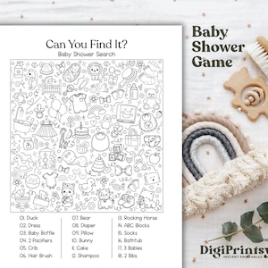 May include: A black and white baby shower search game with a list of items to find. The game is titled "Can You Find It?" and includes a wooden baby brush, a wooden toy, and a rainbow decoration.