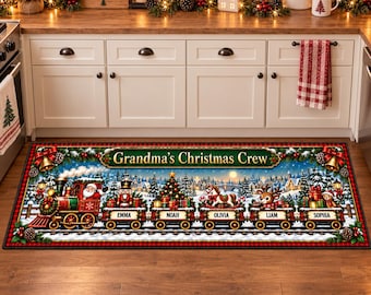 May include: A rectangular floor mat featuring a festive Christmas train illustration with the text Grandma's Christmas Crew. The train cars are labeled with the names Emma, Noah, Olivia, Liam, and Sophia, and include a Santa, nutcracker, and reindeer.