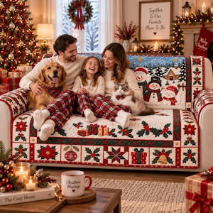 May include: A quilted sofa cover featuring a festive Christmas theme with red poinsettias, green holly leaves, gift boxes, and ornaments. The fabric displays a snowy landscape with three snowmen and the names William, Alex, and Wendy printed on it.
