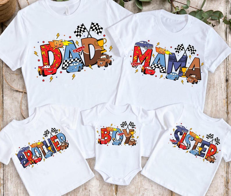May include: White t-shirts with a Cars theme. The shirts say "Dad", "Mama", "Brother", "Boy", and "Sister" with Cars characters and race flags.