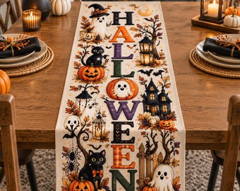 May include: A rectangular table runner featuring a vertical Halloween design with the word HALLOWEEN in colorful letters. The print includes ghosts, black cats, jack-o'-lanterns, a haunted house, lanterns, bats, spiders, and autumn leaves.