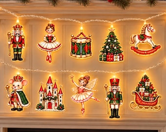 May include: A string of LED Christmas lights featuring ten illuminated ornaments including a nutcracker, a ballerina, a drum, a Christmas tree, a rocking horse, a mouse in a cape, a castle, a fairy, a second nutcracker, and a gift-filled sleigh.