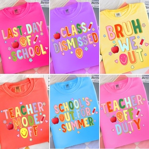 May include: A collection of colorful crew neck sweatshirts with school-themed graphics. Each shirt features a different phrase, including "Last Day of School," "Class Dismissed," and "Teacher Mode Off," with apple and pencil illustrations.
