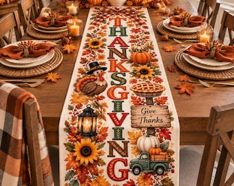May include: A rectangular table runner featuring a Thanksgiving theme with the vertical text THANKSGIVING in bold letters. The design includes a turkey, a lantern, a pie, a wooden sign reading Give Thanks, a green truck, sunflowers, and autumn leaves.