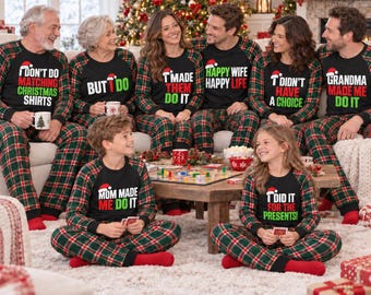 May include: A group of people wearing matching black long-sleeve shirts with red and green plaid pants. Each shirt features a unique humorous phrase in white and green text with a small Santa hat graphic above the lettering.