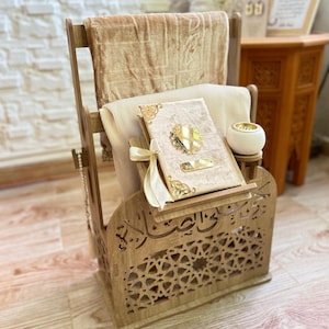 Moroccan Islamic prayer corner organizer with Quran stand, prayer mat storage and sajjada holder. Carved wood MDF with geometric arabesque cutouts and Arabic calligraphy. Complete Islamic home decor piece handcrafted in Morocco. Meaningful Islamic gift for Muslim men and women.