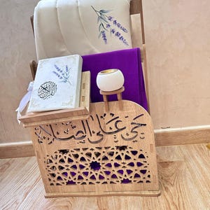 Moroccan Islamic prayer corner organizer styled for women — purple prayer set, Quran stand, prayer mat and tasbih holder. Carved wood MDF with arabesque cutouts and Arabic calligraphy. Elegant Islamic home decor and Islamic gift for women. Handcrafted in Morocco.