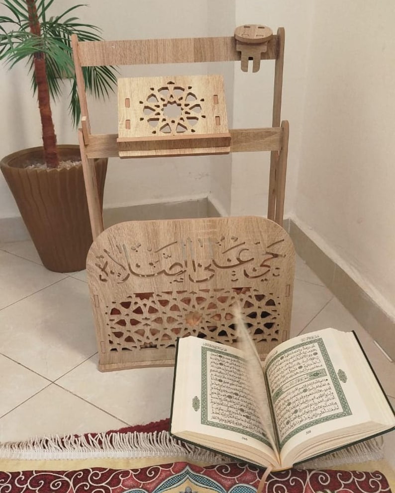 Moroccan Islamic prayer corner organizer with sajjada prayer mat, Quran stand and rehal. Carved wood MDF with arabesque cutouts and Arabic calligraphy. Available in white, brown and beige. Islamic home decor handcrafted in Morocco.