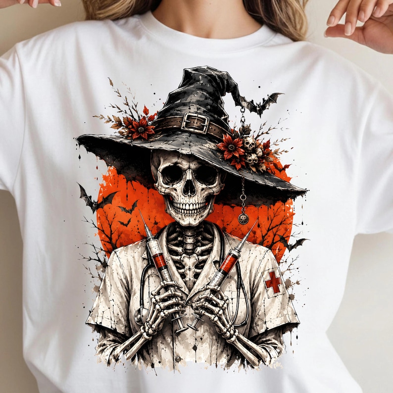 May include: A white t-shirt featuring a graphic of a skeleton dressed as a nurse, wearing a wide-brimmed black hat adorned with red flowers and skulls. The skeleton holds two syringes, with a red moon, bare tree branches, and bats in the background.