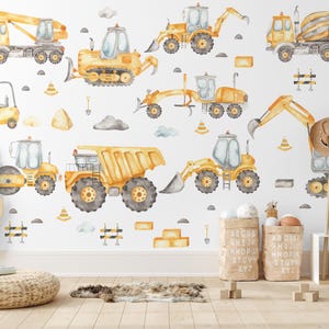 Könnte beinhalten: Aquarellillustrationen verschiedener Baumaschinen, darunter ein Kranwagen, ein Bulldozer, ein Bagger und ein Betonmischer. Die Fahrzeuge sind überwiegend gelb mit grauen Rädern und vor einem weißen Hintergrund mit dekorativen Elementen dargestellt.