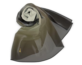 May include: A black and white patterned scarf with a gold logo. The scarf is made of a sheer fabric and is folded in a triangular shape.
