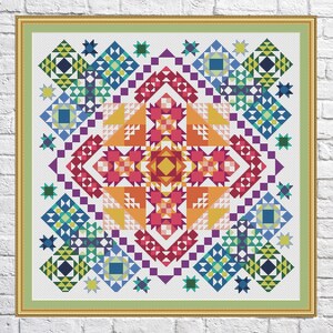 Puede incluir: Un patrón geométrico colorido con un esquema de colores arcoíris. El patrón está formado por cuadrados, triángulos y estrellas. El centro del patrón es una gran estrella con un esquema de colores rojo, naranja, amarillo, verde, azul y morado.