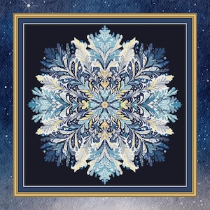 May include: A blue and white snowflake mandala pattern with intricate details, framed in a gold frame against a dark blue background.